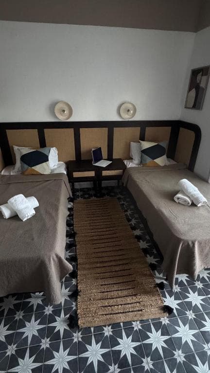 Twin beds in the one-bedroom apartment